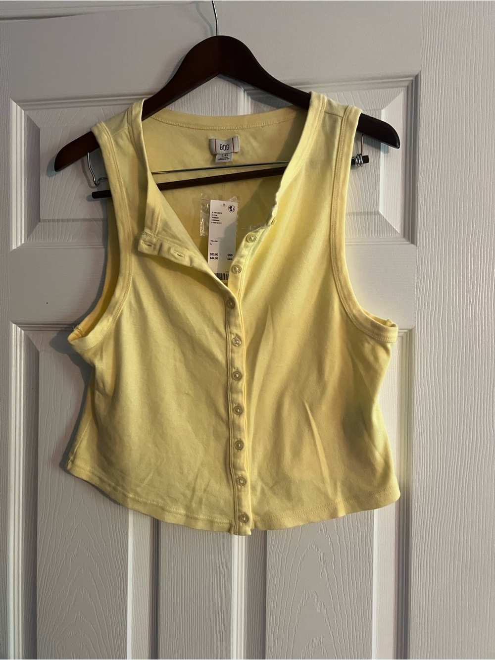 Light yellow sleeveless button-front tank top from BDG. NWT